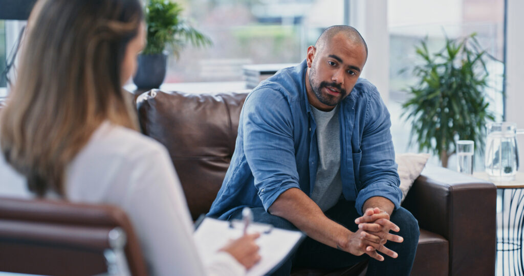 therapist taking notes with patient