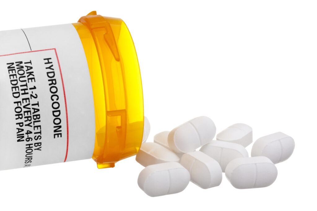 hydrocodone pills spilling out of bottle