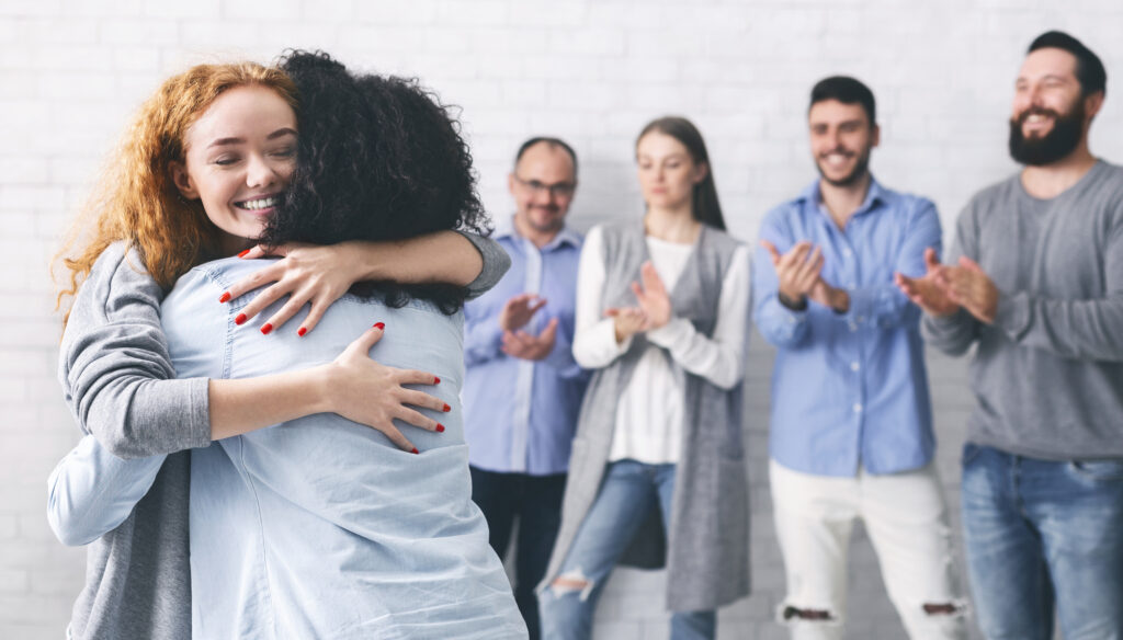 sober group hugging